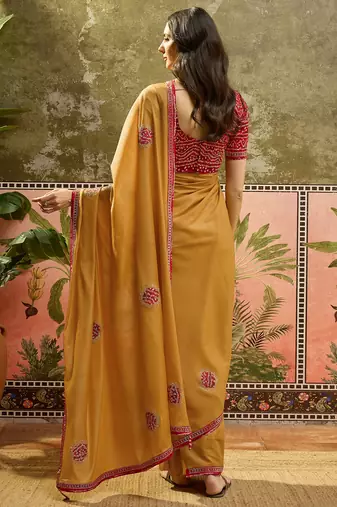 Mustard chiffon bandhni saree with unstitched blouse piece