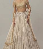 off-white sequin embroidered wedding lehenga with sweetheart neck blouse
