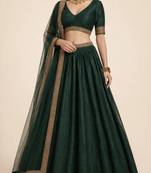 royal dark green traditional lehenga with zari border