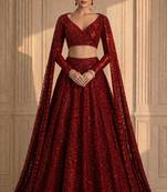 red sequin embroidered bridal gown style lehenga with cape sleeves