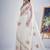 White color soft oregenza tissue handwork zircon border saree