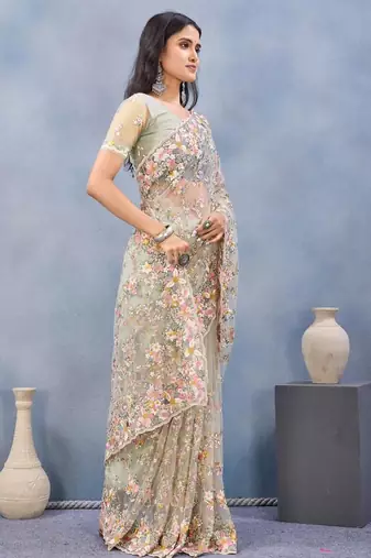Pista color net resham embroidered & handwork zircon work saree