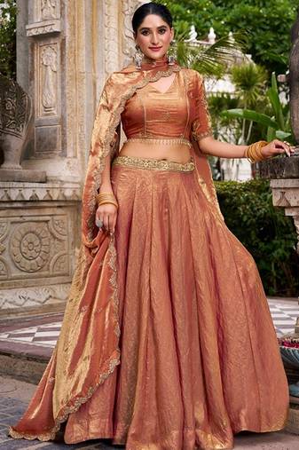Metallic Rust Orange Fendi Silk Lehenga Choli Set With Zari Weaving Dupatta Free Size Upto 42