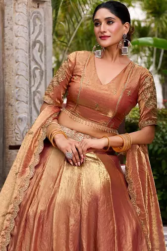 Metallic Rust Orange Fendi Silk Lehenga Choli Set With Zari Weaving Dupatta Free Size Upto 42
