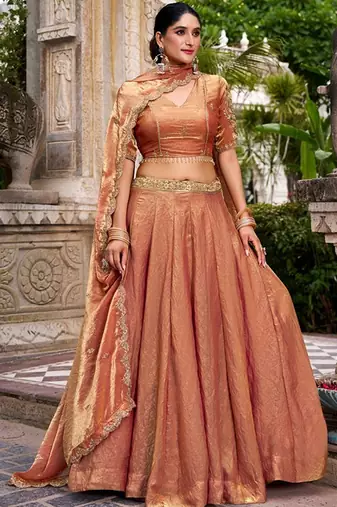Metallic Rust Orange Fendi Silk Lehenga Choli Set With Zari Weaving Dupatta Free Size Upto 42