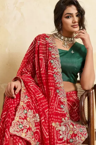 Enthralling red georgette sequins embroidered indina wedding saree