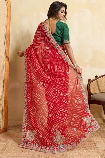 Enthralling red georgette sequins embroidered indina wedding saree