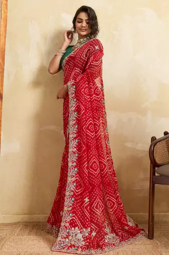 Enthralling red georgette sequins embroidered indina wedding saree