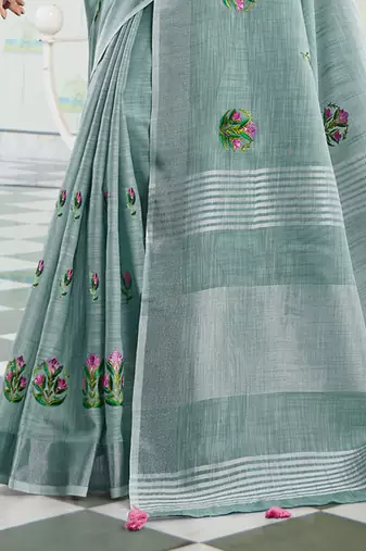 women sea green linen saree with floral embroidery border & tassels