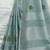 Sutriti women sea green linen saree with floral embroidery border & tassels