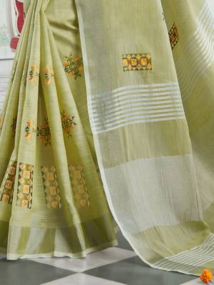 women light green linen saree with floral embroidery border & tassels 3