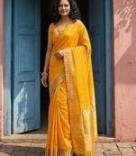 haldi mustard yellow soft silk blend saree with traditional zari border 