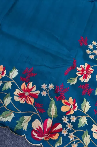 Teal matka silk saree with heavy floral embroidery border with running blouse