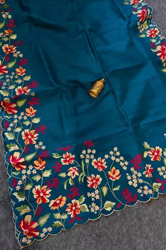Teal matka silk saree with heavy floral embroidery border with running blouse