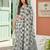 Sutriti women sage green & grey checked linen saree with floral pallu