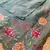 Sea green matka silk saree with heavy floral embroidery border with running blouse