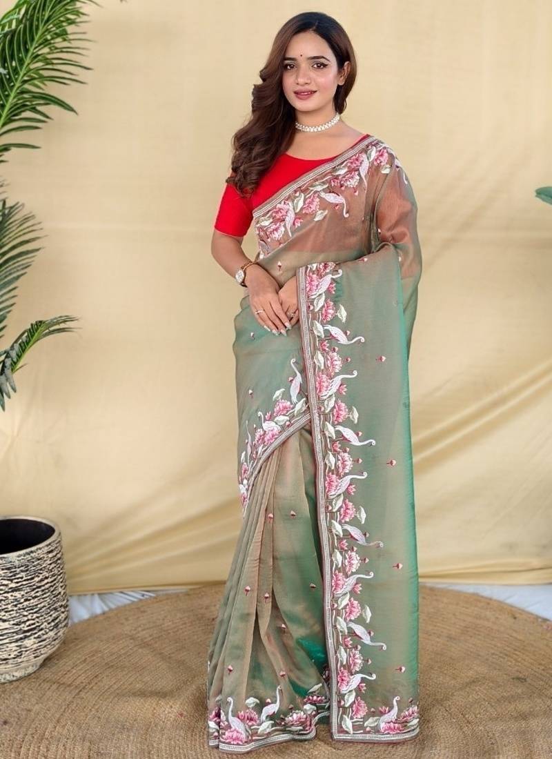 Green royal gabanna silk saree woven in a shiny dual-tone finish