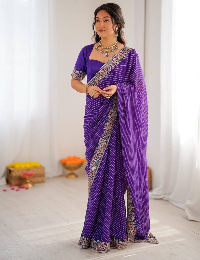 Purple color faux georgette bandhni print & embroidered border saree