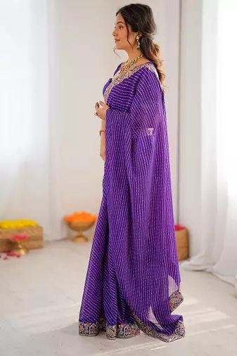 Purple color faux georgette bandhni print & embroidered border saree