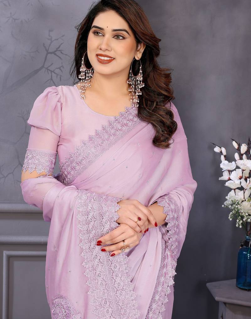 Pink rangoli silk saree with sequence embroidery lace border and matching blouse piece