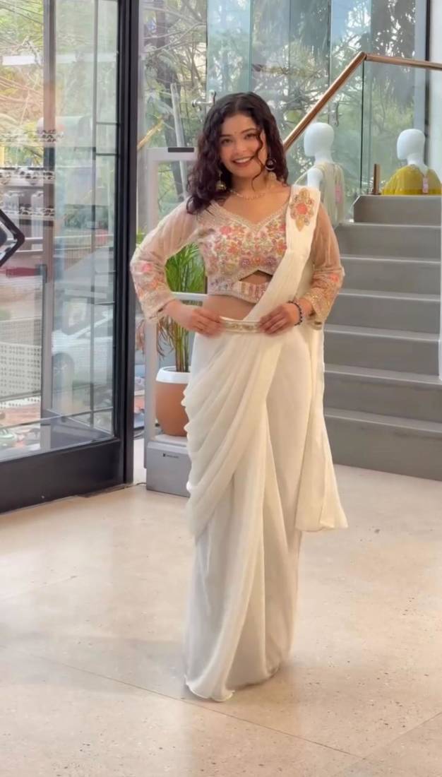 Cream georgette embroidered saree