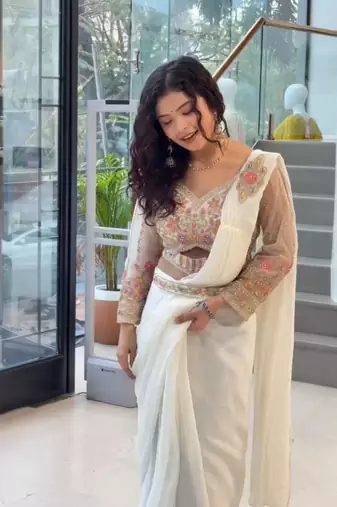 Cream georgette embroidered saree