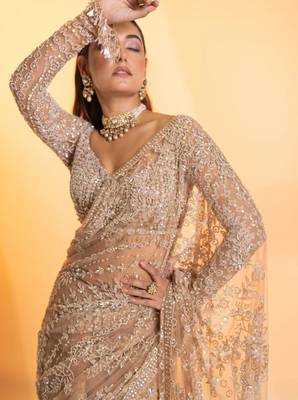 Cream net embroidered saree 4
