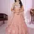 peach net embroidered lehenga set