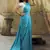 Rama & white color polka dots printed japan satin saree with unstitched blouse