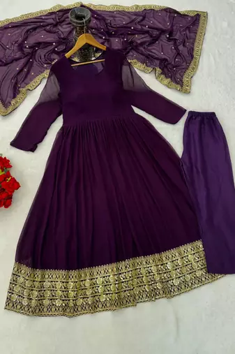 Woman's purple festival long gown with embroidery sequnce work