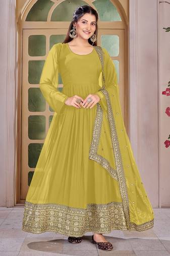 Woman's yellow festival long gown with embroidery sequnce work