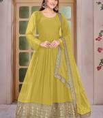 Woman's yellow festival long gown with embroidery sequnce work