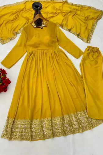 Woman's yellow festival long gown with embroidery sequnce work