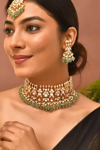 Gold plated kundan green stones choker set