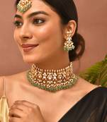 Gold plated kundan green stones choker set