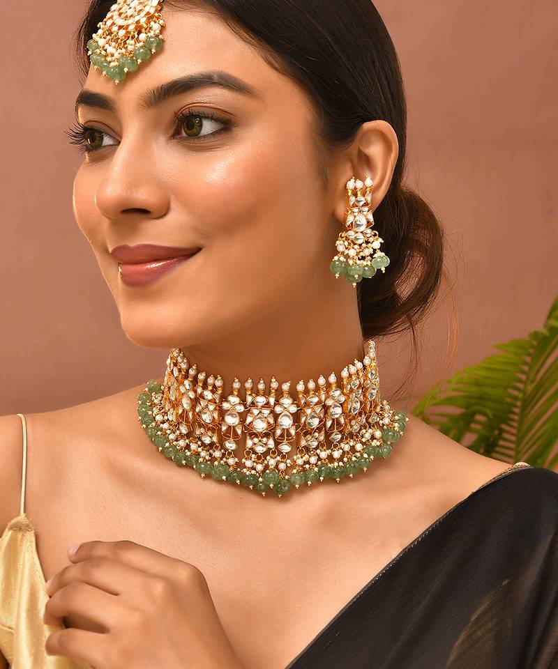 Gold plated kundan green stones choker set