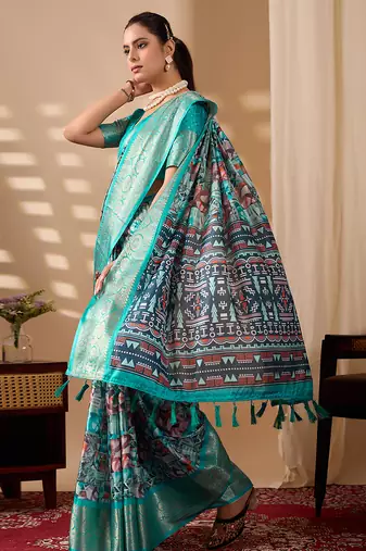 Turquoise green lichi silk saree with abstract & floral digital print and rich zari woven border with designer blouse