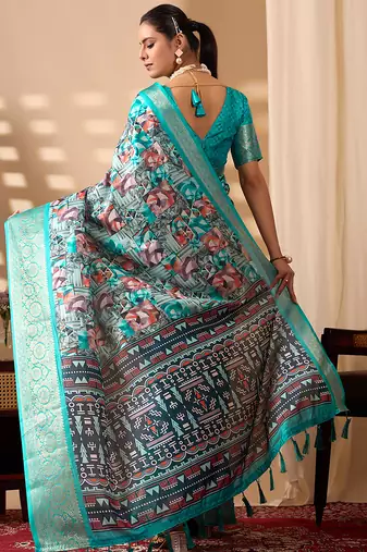 Turquoise green lichi silk saree with abstract & floral digital print and rich zari woven border with designer blouse
