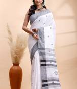 White & black handloom saree with minimalist woven motifs and classic contrast border