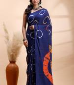 Ink blue malmal cotton saree with artistic tie-dye circles & vibrant handcrafted patterns