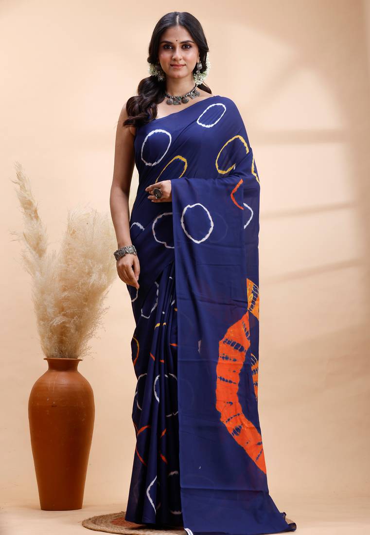Ink blue malmal cotton saree with artistic tie-dye circles & vibrant handcrafted patterns