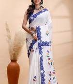 White & blue handloom saree with intricate applique work and floral artistic border