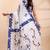 White & blue handloom saree with intricate applique work and floral artistic border