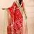Red muslin saree with delicate jamdani motifs and green contrast border