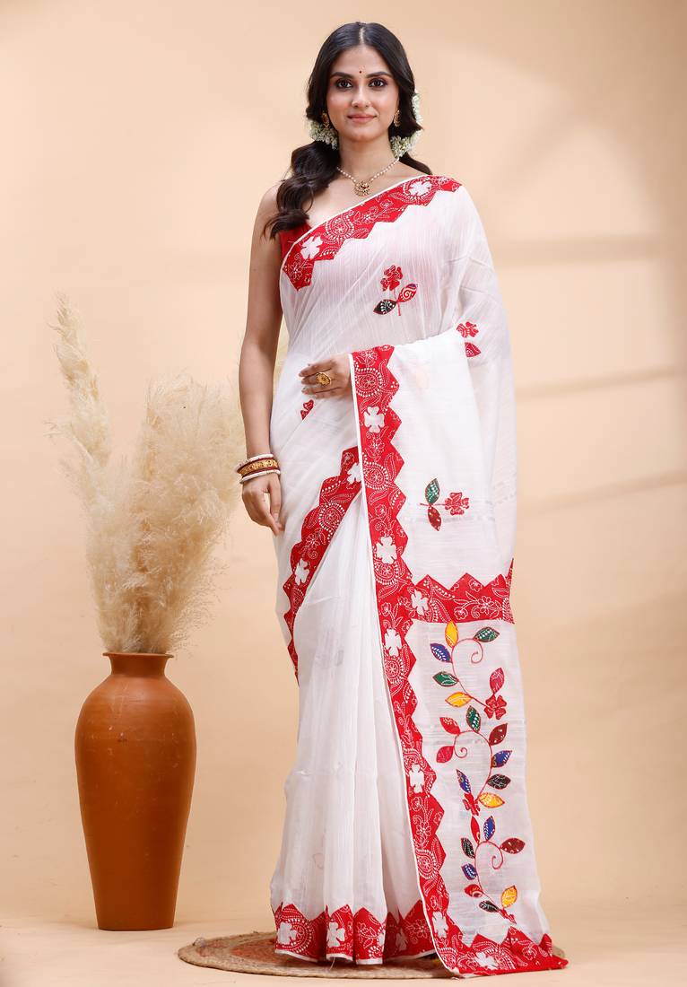 White & red handloom saree with intricate applique work and floral artistic border