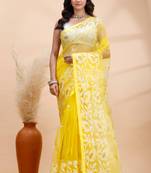 Yellow and white muslin saree with delicate jamdani motifs and self border