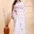 White handloom cotton saree with delicate red and golden floral buti and artistic woven pallu