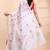 White handloom cotton saree with delicate red and golden floral buti and artistic woven pallu