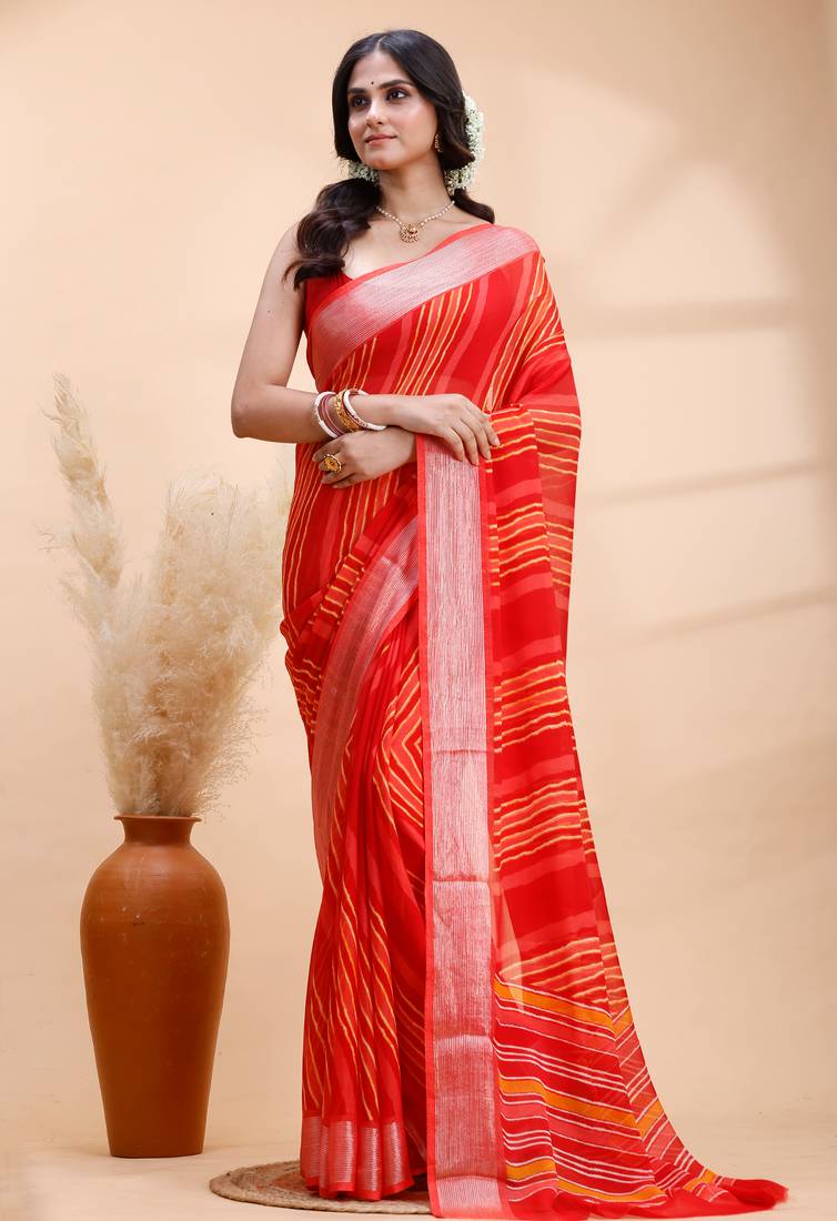 Red chiffon saree with elegant striped weave and subtle silver border detailing