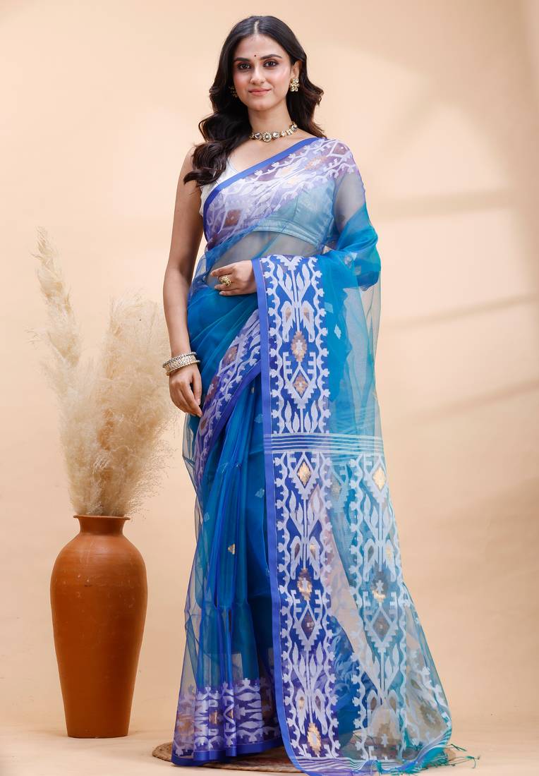 Blue dual toned muslin saree with delicate jamdani motifs and graceful contrast border